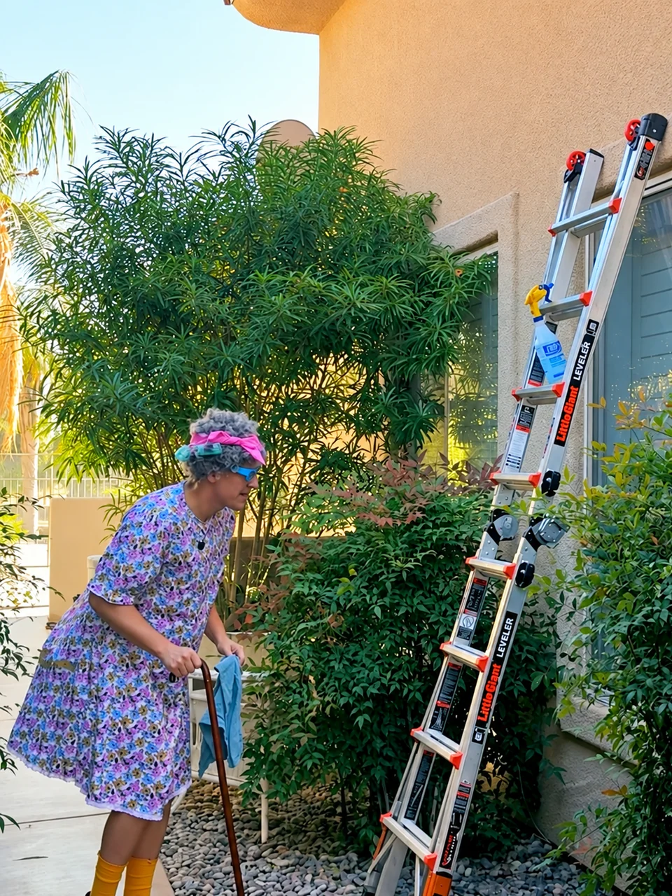 Glow Window Cleaning commercial with a ladder outside a home